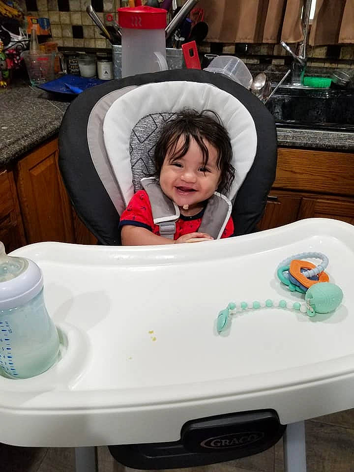 Aries is registered to the contest to win money with this photo: automotive_design, automotive_tire, automotive_wheel_system, baby, baby_toddler_clothing, child, comfort, fun, green, happy, head, jacket, joy, leisure, motor_vehicle, person, personal_protective_equipment, recreation, smile, t_shirt