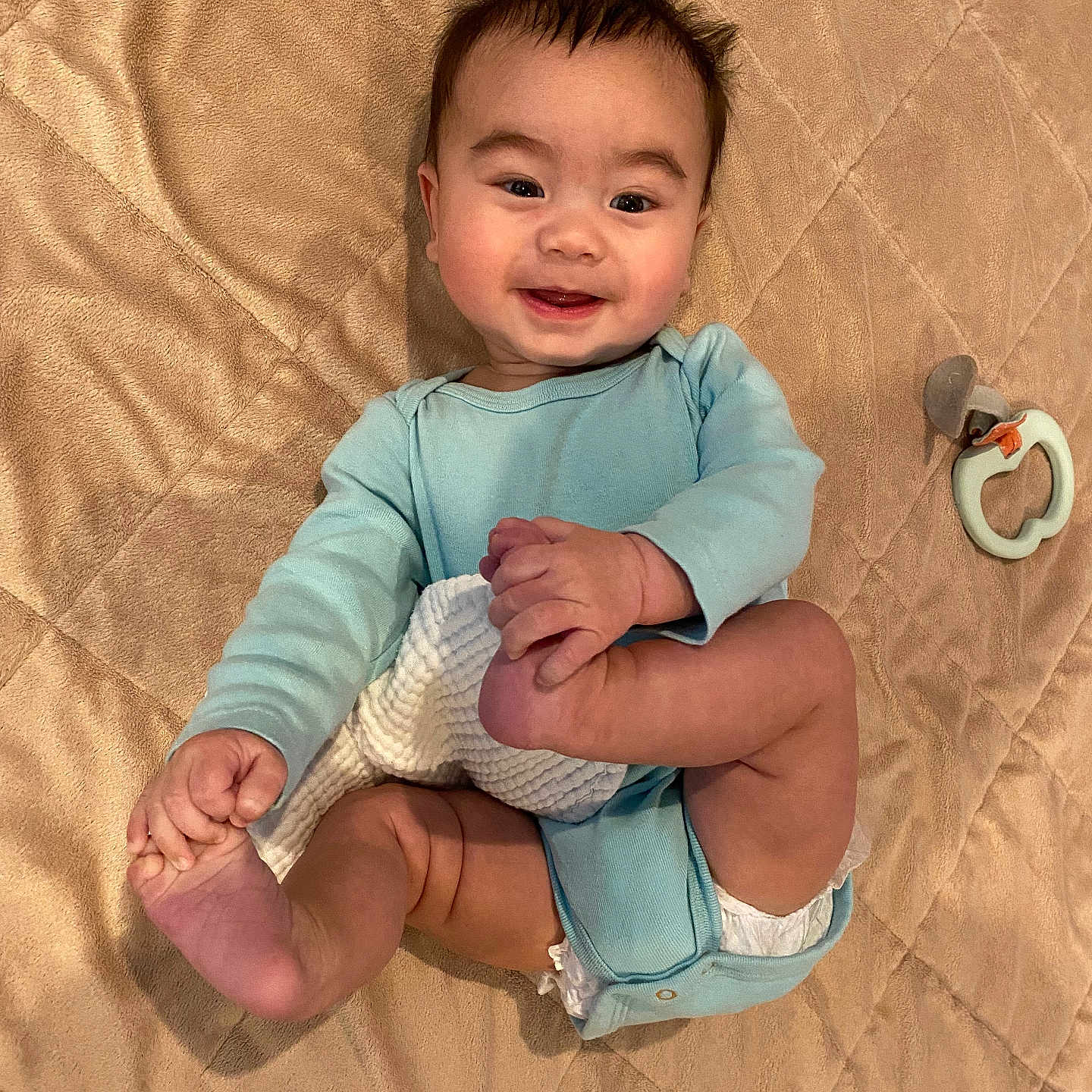 Cade is registered to the contest to win money with this photo: baby, bodypart, clothing, diaper, face, finger, footwear, furniture, hand, happy, head, newborn, pants, person, photography, portrait, shorts, sitting, smile, t_shirt