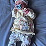 Levi joined the competition — help win amazing prizes! baby, pacifier, bed, blanket, pajamas, infant, child, clothing, sleepwear, lying_down, cute, soft_toys, headwear, footwear, indoors, person, resting, sleeping, comfort, toddler