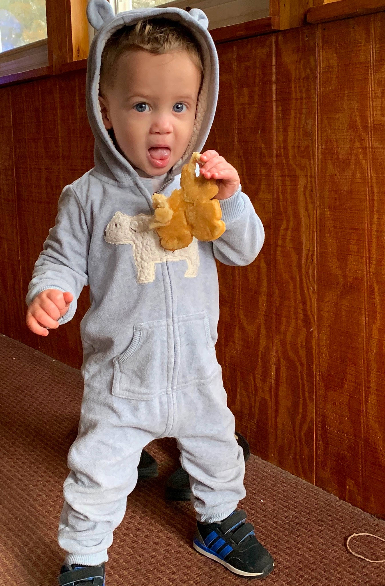 Abel is registered to the contest to win money with this photo: baby, cheek, child, child_model, nose, outerwear, person, shoe, surprise, toddler