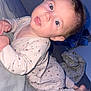 Lùna participe au concours pour gagner de l'argent avec cette photo : baby, child, pajamas, bed, crawling, indoor, face, person, sleepwear, blanket, foot, hand, curious, wide_eyes, expression, soft_lighting, head, infant, young_child, home