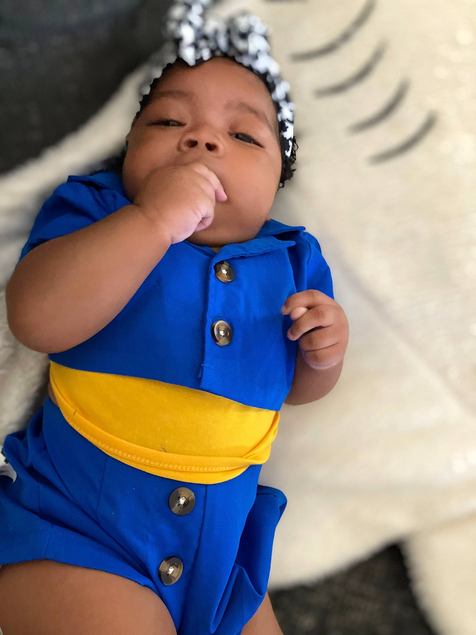 Michaela joined the competition — help win amazing prizes! arm, azure, baby, baby_toddler_clothing, child, electric_blue, eye, finger, hand, happy, head, organ, outerwear, pattern, person, sitting, skin, sleeve, textile, thigh