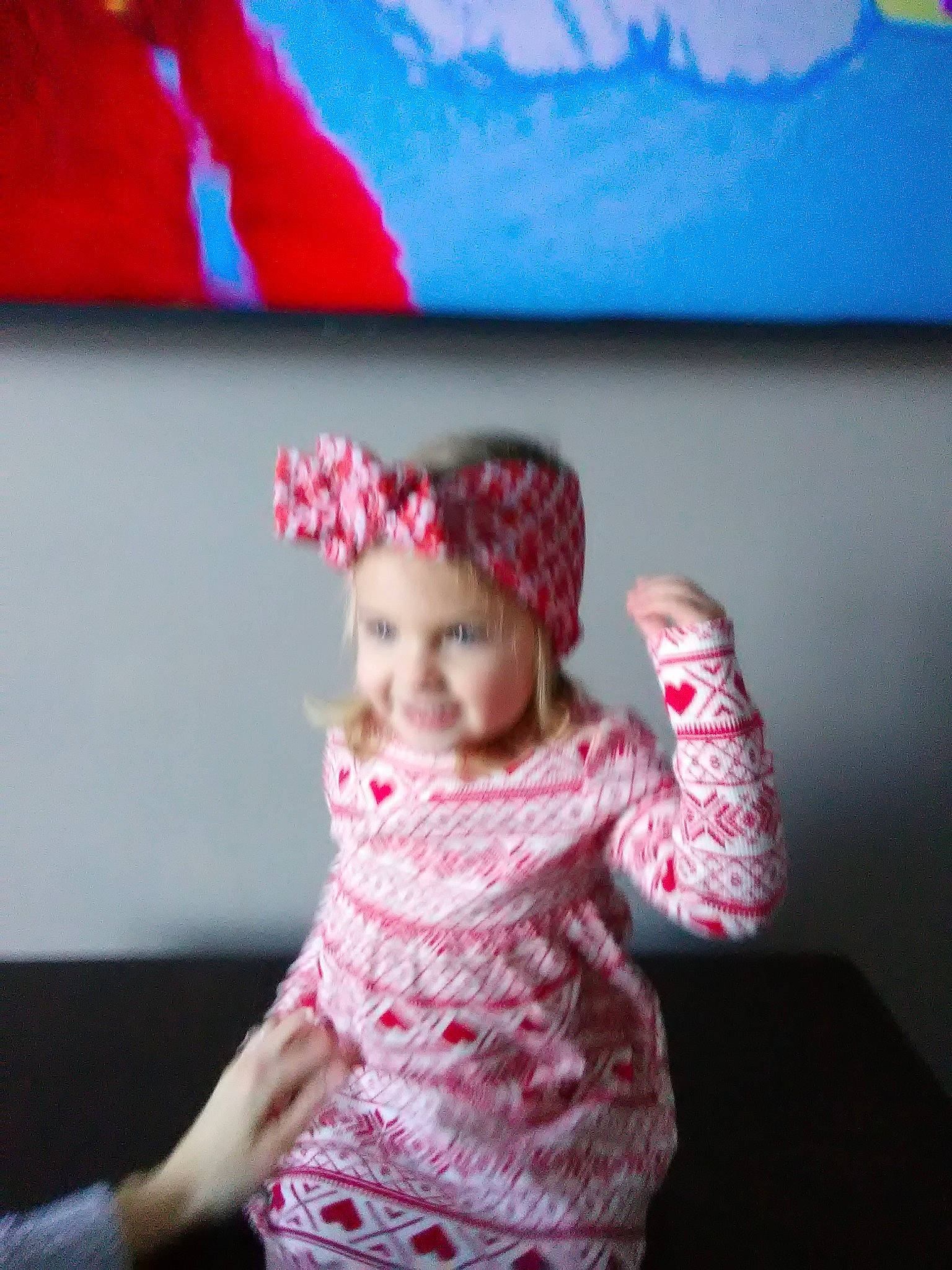 Macy is registered to the contest to win money with this photo: baby, baby_toddler_clothing, cap, child, electric_blue, fashion_accessory, fun, happy, hat, knit_cap, leisure, magenta, pattern, person, pink, room, sitting, sleeve, toddler, wool