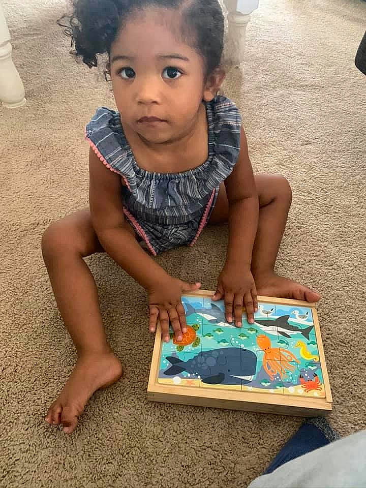 Mia is registered to the contest to win money with this photo: adaptation, art, child, face, fun, head, learning, leisure, person, play, reading, sitting, summer, technology, toddler, vacation