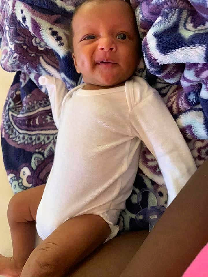 Micheal is registered to the contest to win money with this photo: baby, cheek, child, leg, person, sitting, smile, toddler