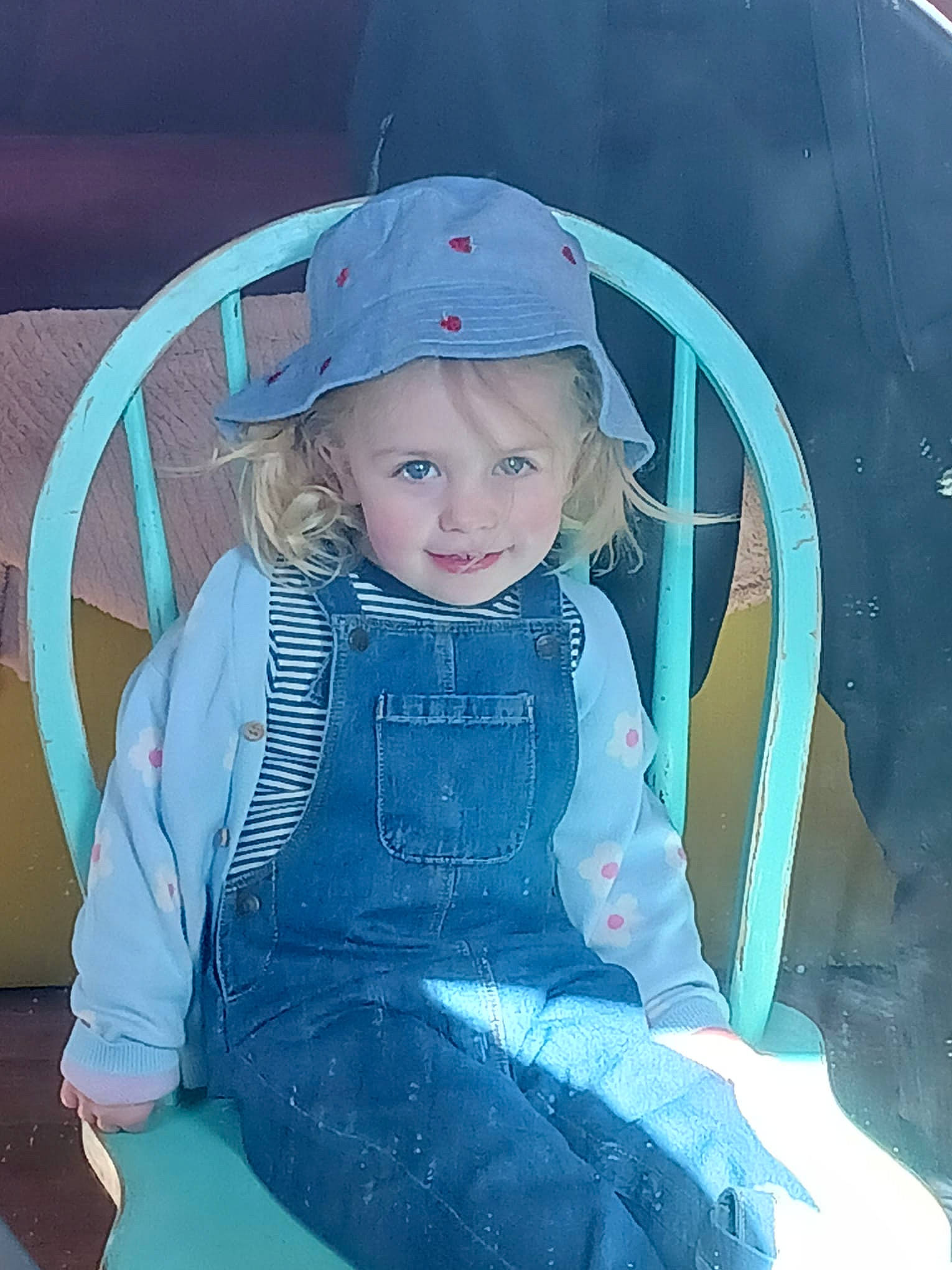 Jessica is registered to the contest to win money with this photo: baby_products, baby_toddler_clothing, baseball_cap, cap, chair, child, electric_blue, fashion_accessory, fun, hair, hat, human_body, joy, pattern, person, recreation, sitting, sleeve, tints_and_shades, toddler