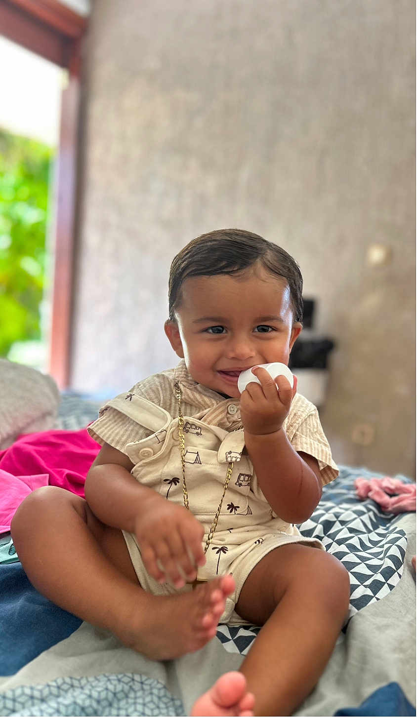 Gypsyanno participe au concours pour gagner de l'argent avec cette photo : toddler, child, smiling, indoor, bed, overalls, shorts, clothing, person, happy, face, skin, furniture, foot, hand, sitting, playful, cute, chain, background