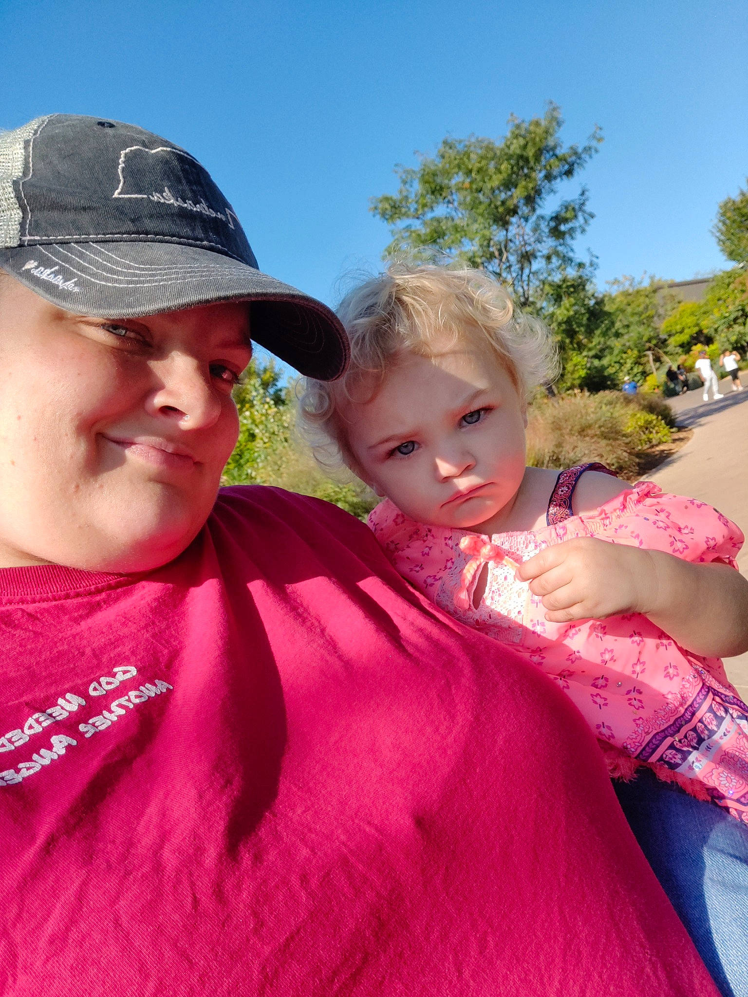 Ayspen is registered to the contest to win money with this photo: baby, baseball_cap, cap, child, event, fun, gesture, grass, happy, hat, headwear, interaction, iris, joy, lip, magenta, person, pink, skin, sky