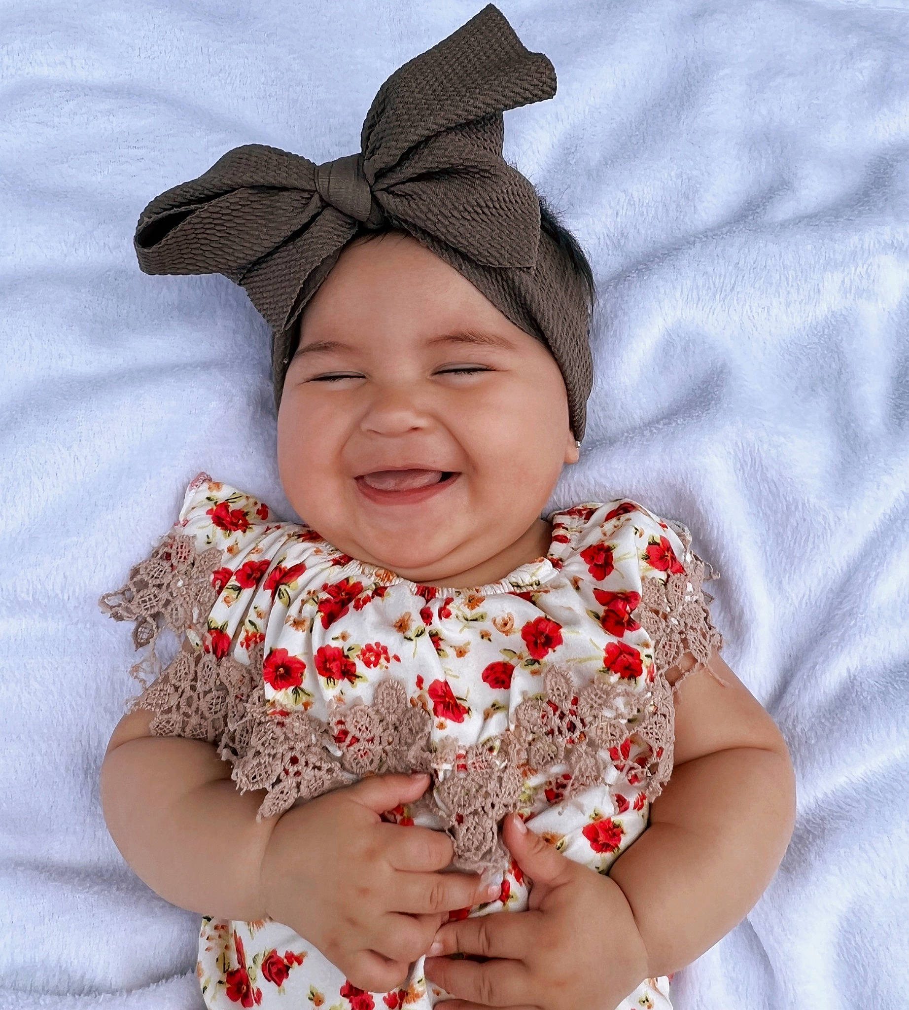 Mia AnahÍ joined the competition — help win amazing prizes! baby, baby_toddler_clothing, child, chin, collar, face, facial_expression, gesture, happy, hat, head, headwear, joy, lip, outerwear, pattern, person, pink, skin, sleeve