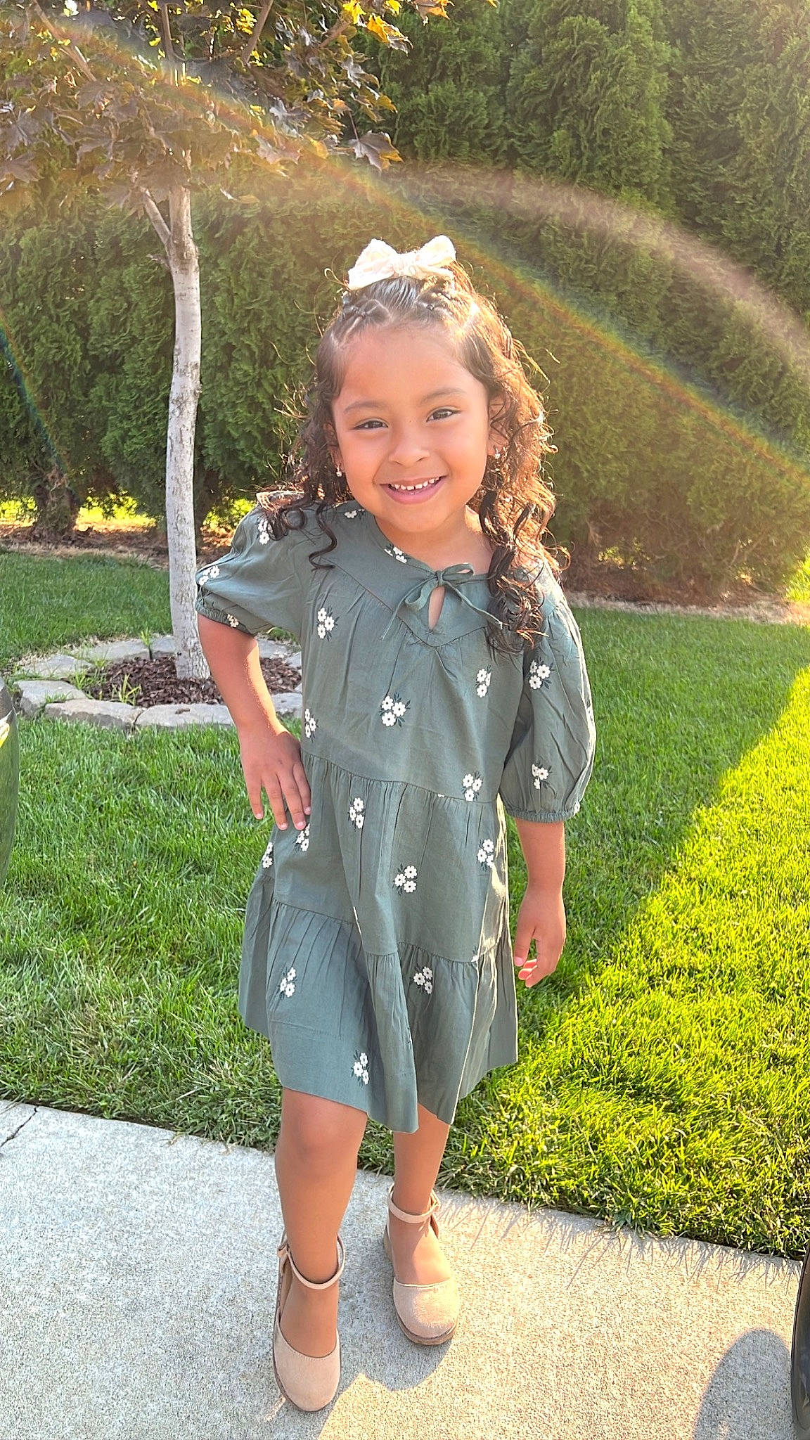 Melanie is registered to the contest to win money with this photo: botany, dress, eye, face, grass, grass_family, hair, happy, head, joy, lawn, leaf, leisure, one_piece_garment, people_in_nature, person, photograph, plant, recreation, sleeve