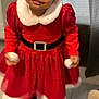 Liamani is registered to the contest to win money with this photo: child, toddler, red_dress, holiday_outfit, white_fur_collar, black_belt, indoor, curtain, tile_floor, holding_objects, smiling, person, young_child, festive, cute, portrait, standing, clothing, happy, face