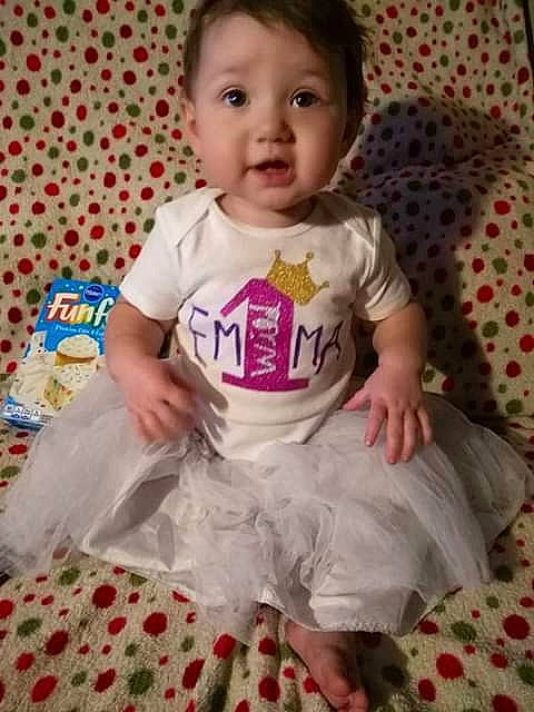 Emmaleigh is registered to the contest to win money with this photo: baby_products, bedtime, cheek, child, day, girl, human_hair_color, infant, iris, pattern, person, pink, play, product, sitting, skin, surprise, textile, toddler