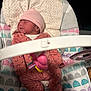 Zoey is registered to the contest to win money with this photo: newborn, baby, sleeping, pink_hat, onesie, baby_rocker, toy_bar, infant, child, sleep, clothing, patterned, cozy, indoor, soft_toys, cute, resting, baby_accessories, infant_care, peaceful