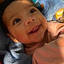 Zoey is registered to the contest to win money with this photo: baby, child, smiling, face, eyes, blanket, clothing, infant, portrait, cute, happy, indoors, person, blue, pink, soft, young, skin, expression, closeup