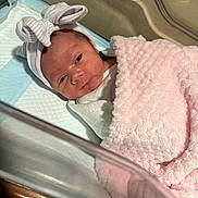 Melanie joined the competition — help win amazing prizes! newborn, baby, infant, blanket, pink, hat, bow, hospital, bassinet, bed, sleeping, wrapped, cute, face, headwear, soft, person, child, indoor, newborn_baby