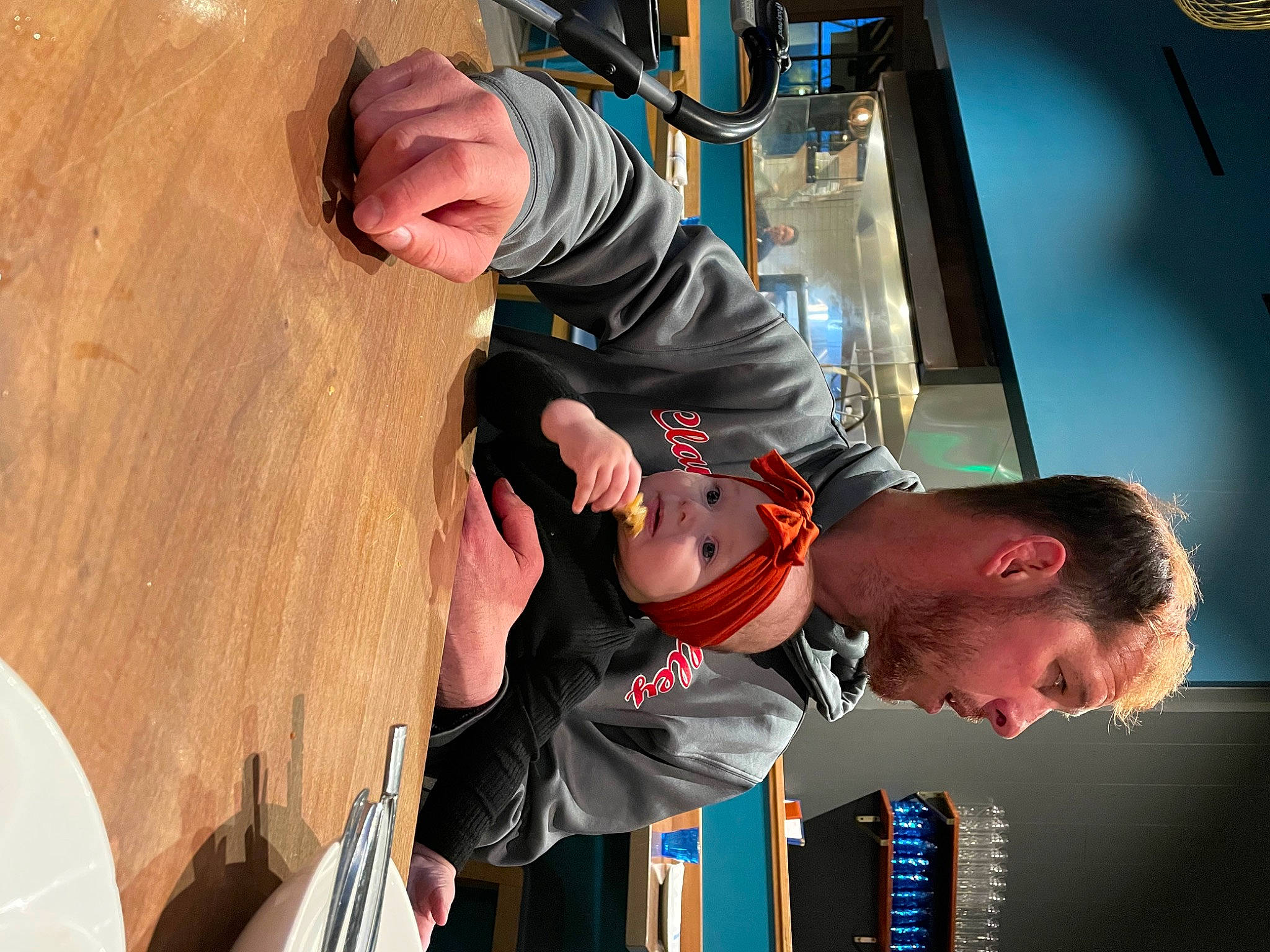 Gracelyn is registered to the contest to win money with this photo: blurred, chair, elbow, event, flooring, fun, hardwood, headwear, person, recreation, room, wood, wrist