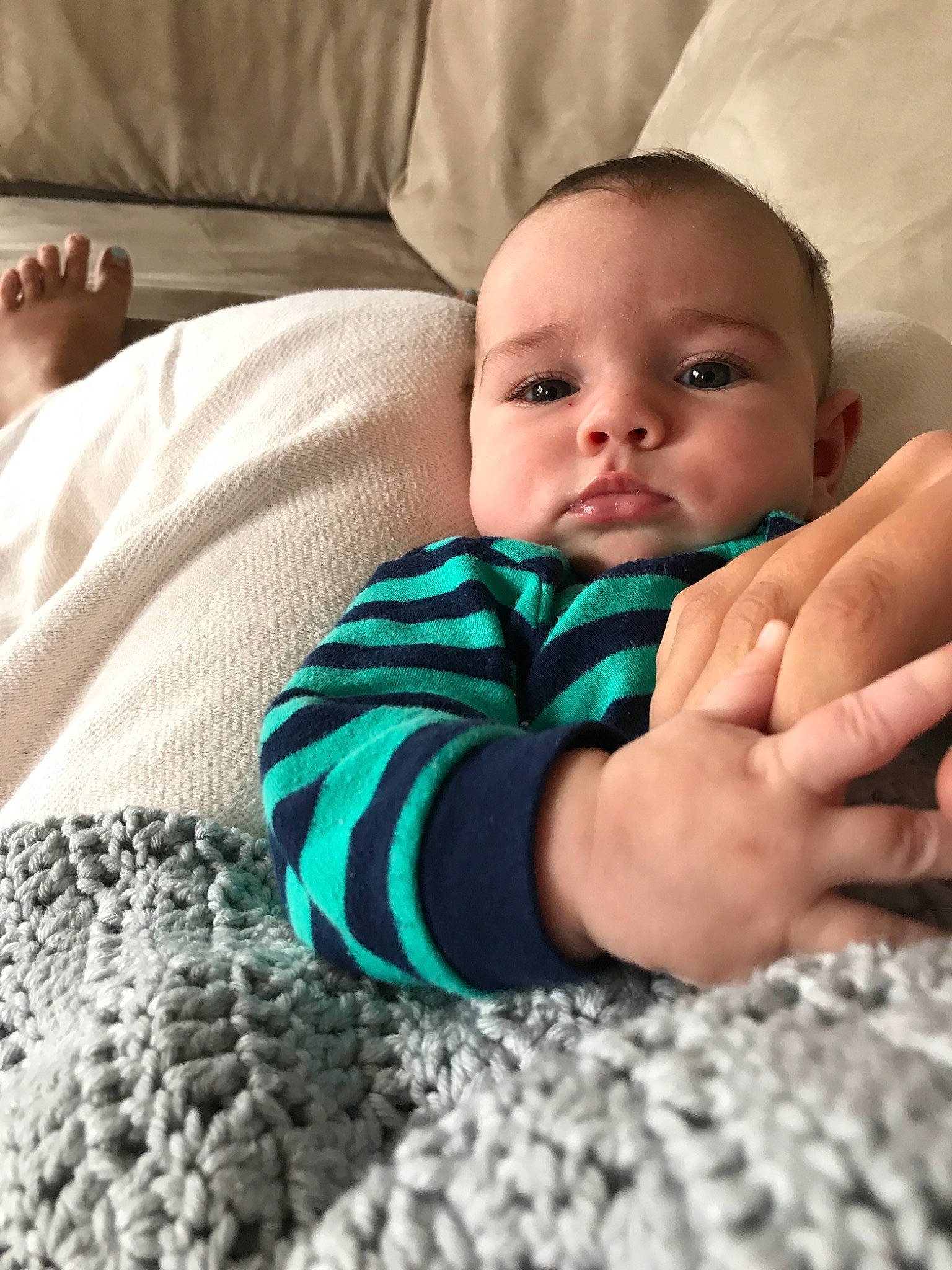 Hank is registered to the contest to win money with this photo: arm, baby, cheek, child, eye, face, finger, hand, head, leg, mouth, nail, nose, person, photography, sitting, skin, thumb, toddler