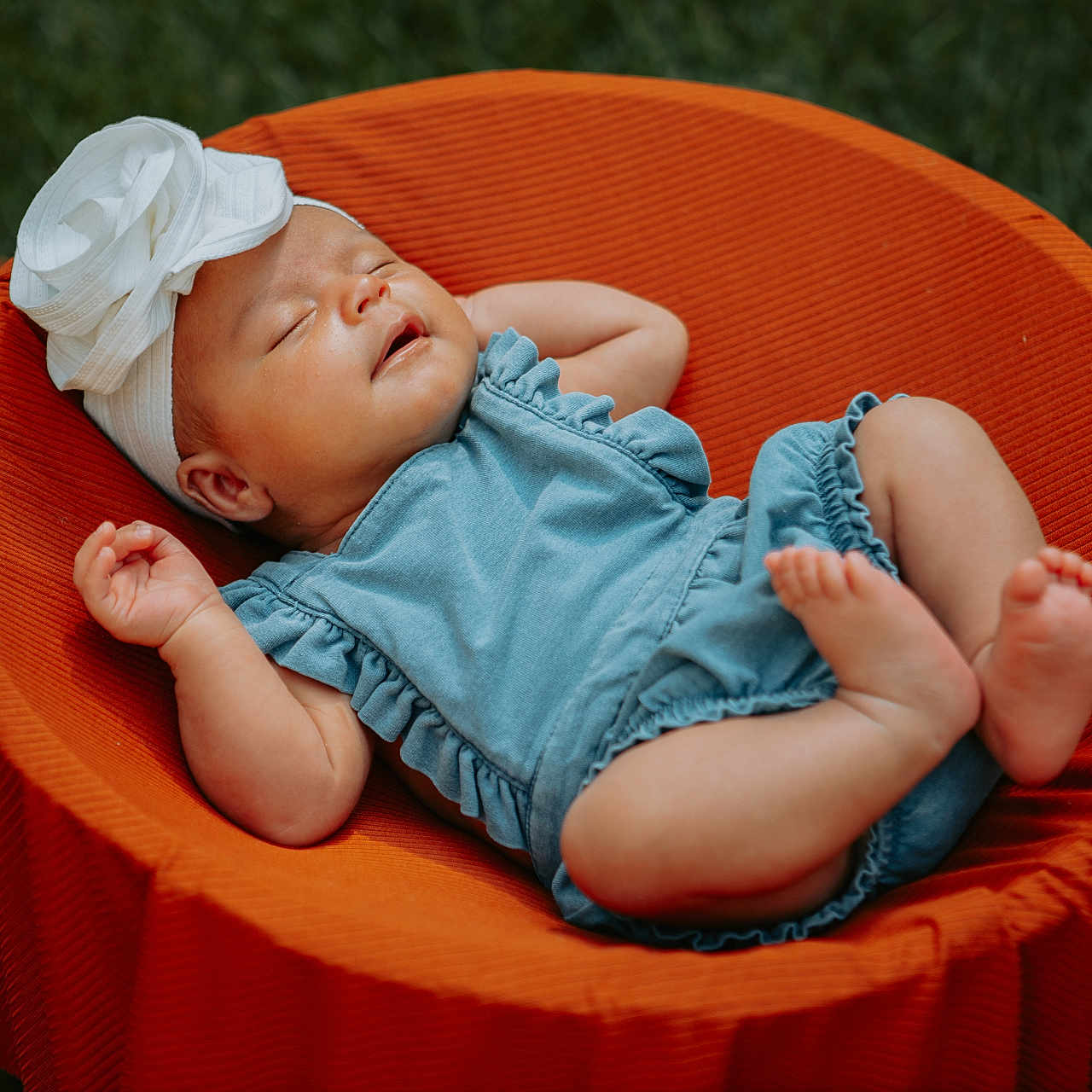 Lydia joined the competition — help win amazing prizes! baby, blue_romper, child, closed_eyes, cute, flower_headband, grass, infant, nature, orange_chair, outdoor, peaceful, portrait, relaxing, resting, sleeping, small_feet, soft_light, summer, white_headband