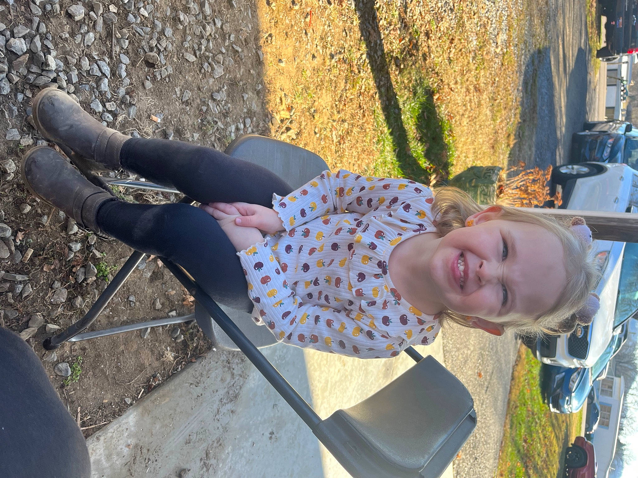 Eva June joined the competition — help win amazing prizes! car, city, electric_blue, fun, grass, human_leg, human_settlement, joy, leisure, outdoor_play_equipment, people_in_nature, person, plant, recreation, sitting, smile, soil, thigh, toddler, tree