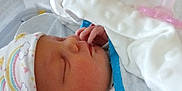 Irene joined the competition — help win amazing prizes! newborn, baby, sleeping, hat, blanket, hospital, bassinet, infant, cute, cozy, clothing, face, hand, peaceful, indoors, closeup, person, portrait, soft, resting