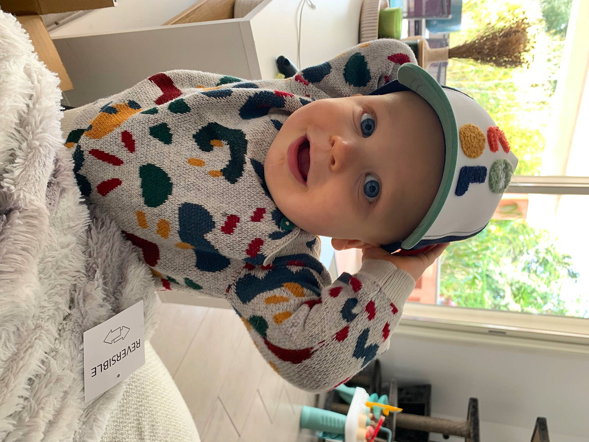 Noa participe au concours pour gagner de l'argent avec cette photo : art, baby, carmine, child, doll, fun, fur, headwear, leisure, linens, pattern, person, personal_protective_equipment, room, toddler, toy, visual_arts, white, window