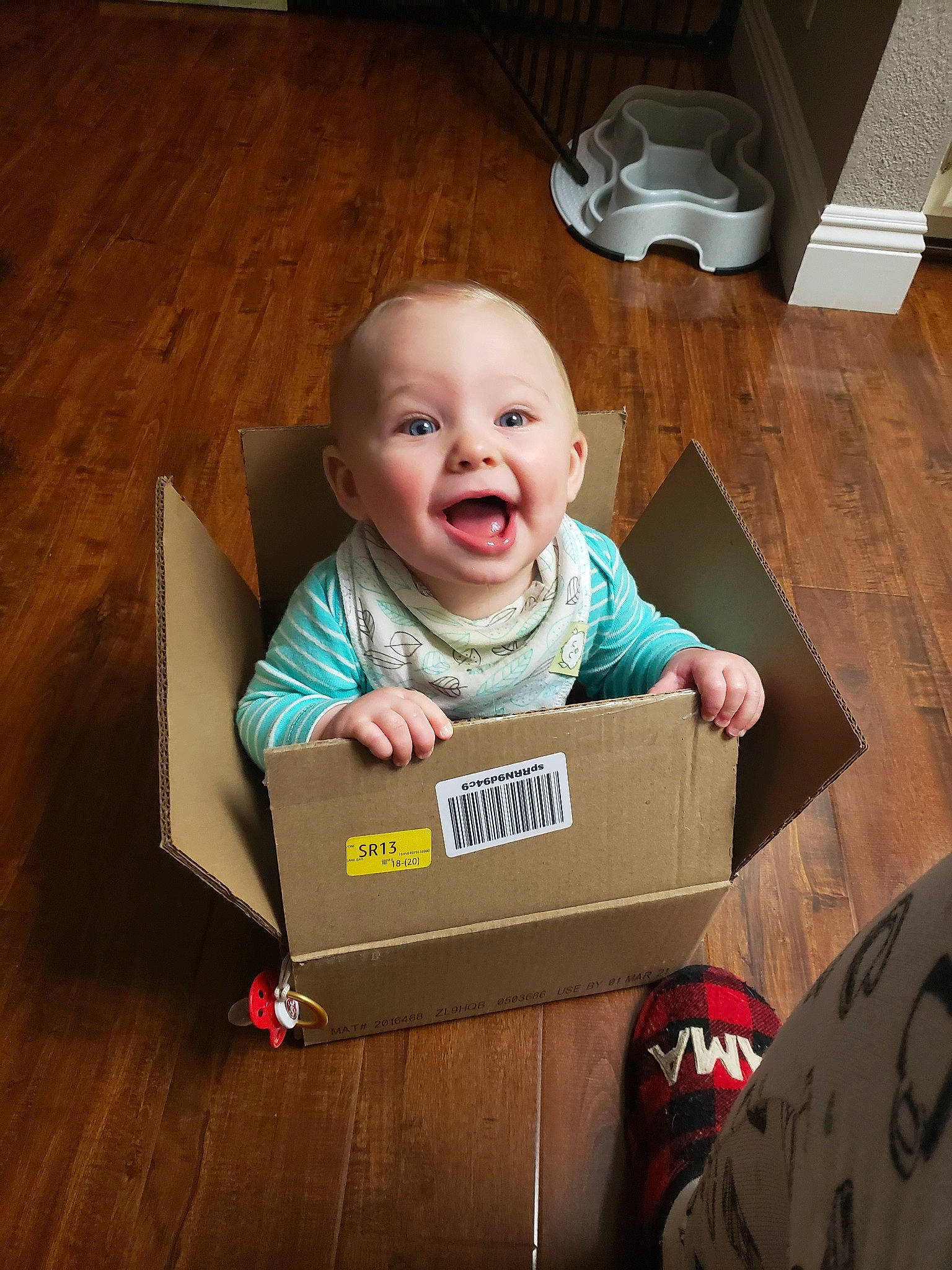 Tristan is registered to the contest to win money with this photo: baby, box, cardboard, child, facial_expression, laugh, packaging_and_labeling, person, smile, toddler