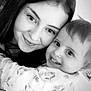 black_and_white, woman, toddler, child, smiling, hug, close_up, portrait, happy, face, person, indoor, affection, love, family, cute, joyful, young, casual, clothing