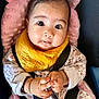 Pari is registered to the contest to win money with this photo: baby, car_seat, child, closeup, clothing, curious, cute, expression, face, hands, indoor, infant, onesie, person, pink_cushion, portrait, seatbelt, sitting, wide_eyes, yellow_bib