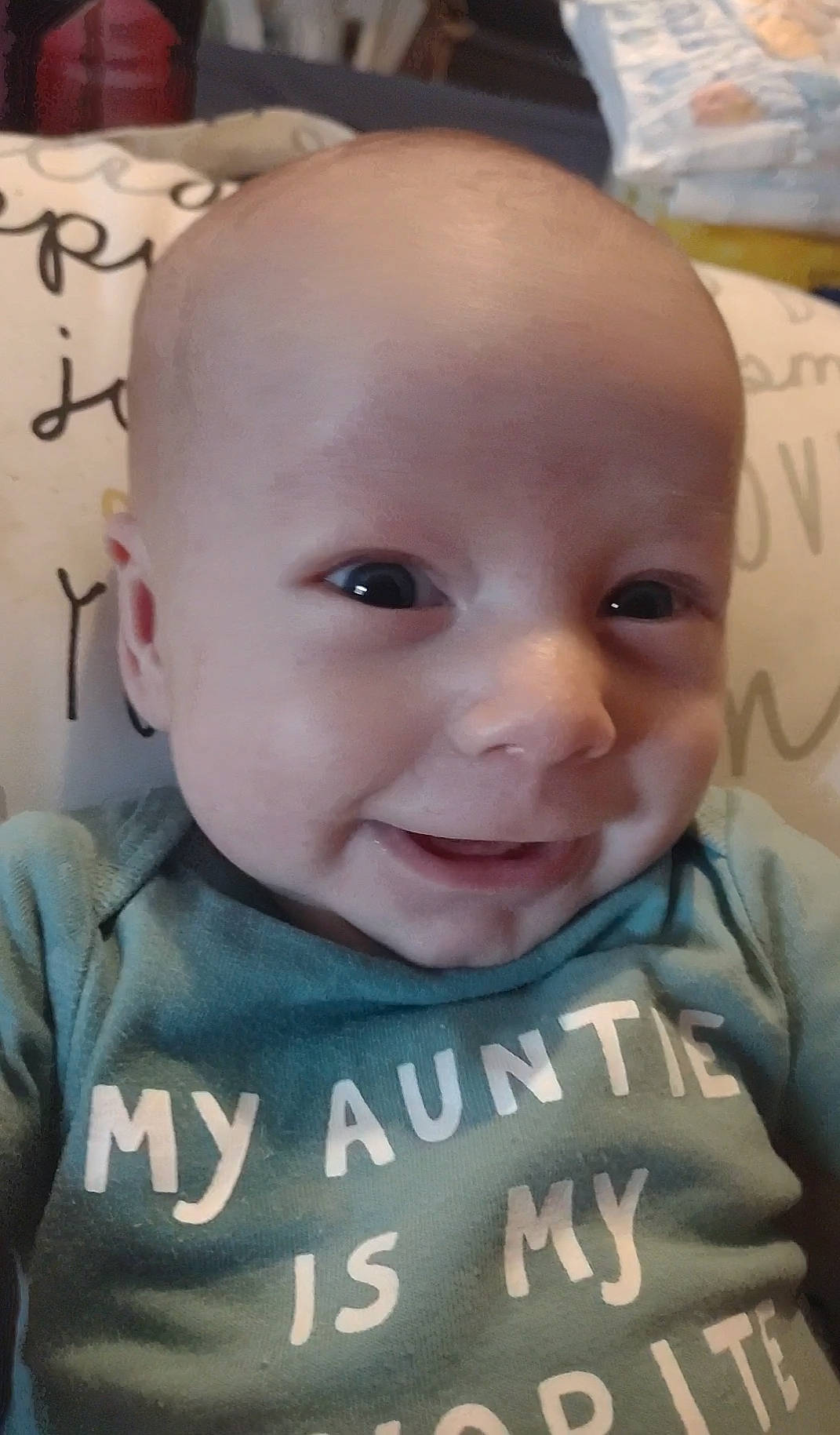 Langston is registered to the contest to win money with this photo: baby, baby_toddler_clothing, cheek, child, chin, ear, eye, eyebrow, eyelash, forehead, happy, iris, lip, mouth, nose, person, sitting, skin, sleeve, smile