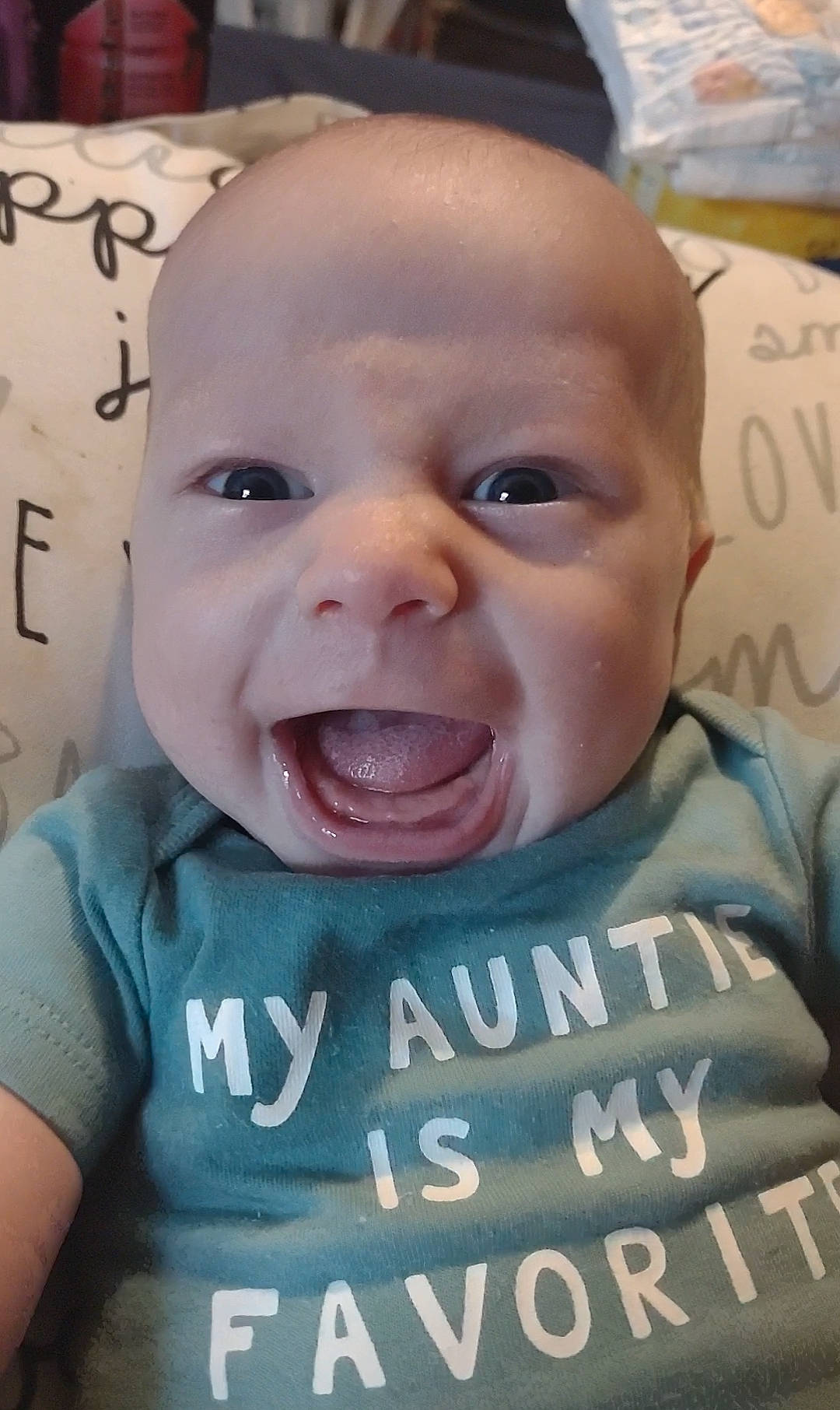 Langston is registered to the contest to win money with this photo: baby, cheek, chin, ear, eyebrow, eyelash, facial_expression, forehead, gesture, happy, iris, jaw, lip, mammal, mouth, nose, person, skin, sleeve, smile
