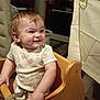 Jaxon is registered to the contest to win money with this photo: toddler, child, smiling, high_chair, wooden_chair, onesie, curly_hair, indoor, happy, person, baby, clothing, hand, furniture, seat, home, fabric, expression, cute, portrait