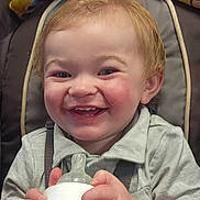 Jaxon joined the competition — help win amazing prizes! baby, blanket, bottle, cheeks, child, closeup, clothing, cute, face, feeding, hands, happy, indoor, joy, person, seat, sitting, smile, toddler, young_child
