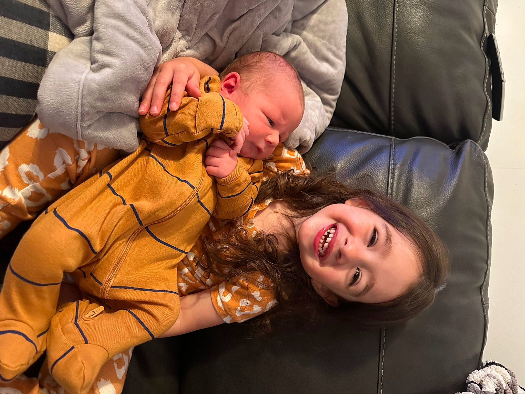 Emilia joined the competition — help win amazing prizes! abdomen, baby, child, comfort, couch, event, flash_photography, fun, gesture, happy, jewellery, joy, laugh, love, mouth, person, sitting, smile, toddler, tree