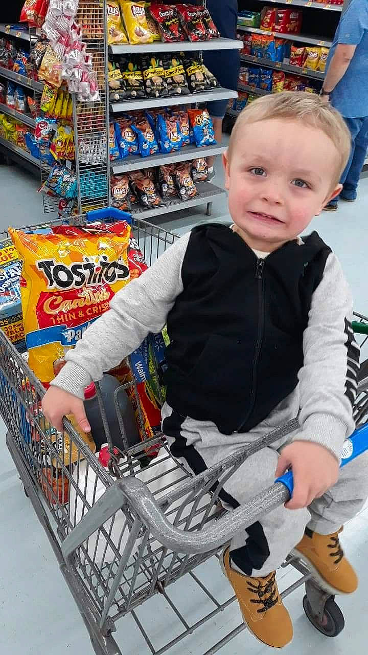 Braxton is registered to the contest to win money with this photo: business, cart, child, convenience_store, customer, grocery_store, person, retail, shopping, shopping_cart, snack, supermarket, toddler, vehicle