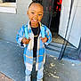 Hazel joined the competition — help win amazing prizes! boy, child, clothing, coat, door, face, footwear, happy, head, jacket, jeans, male, pants, person, photography, portrait, shoe, sitting, smile, standing