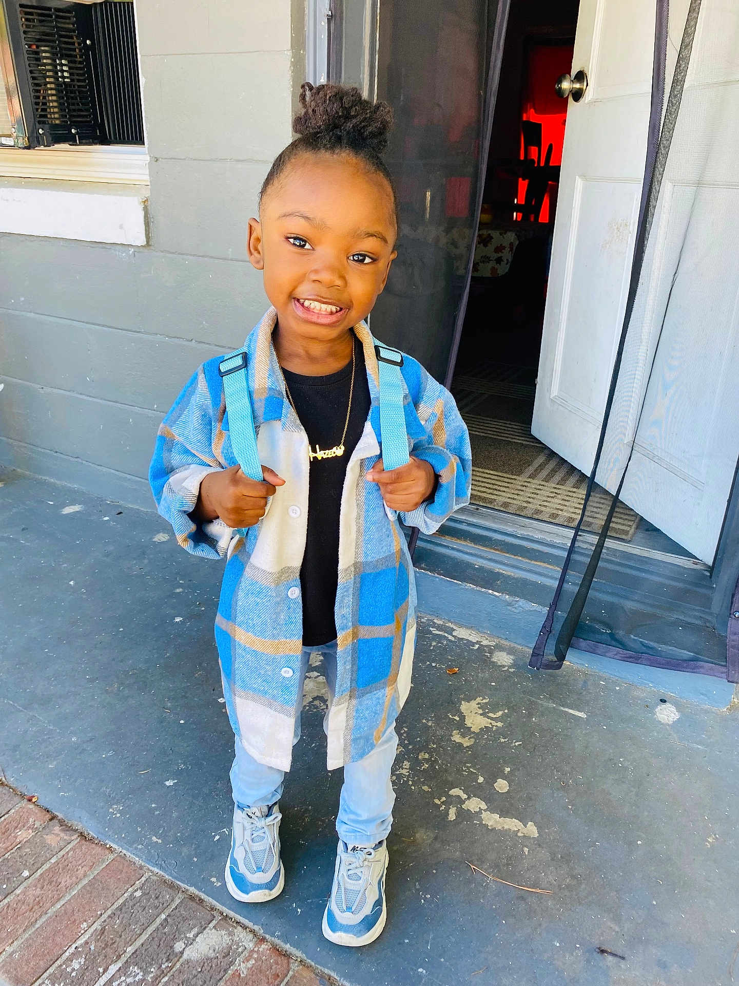 Hazel joined the competition — help win amazing prizes! boy, child, clothing, coat, door, face, footwear, happy, head, jacket, jeans, male, pants, person, photography, portrait, shoe, sitting, smile, standing