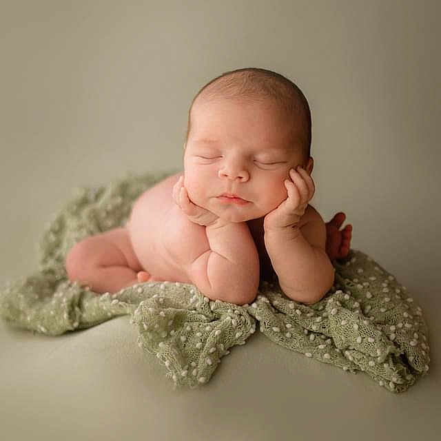 Axl is registered to the contest to win money with this photo: baby, blanket, bodypart, bonnet, clothing, cushion, face, finger, glove, hand, hat, head, homedecor, newborn, person, photography, portrait, quilt, sleeping, wrist