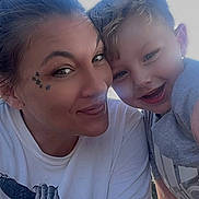 Grayson is registered to the contest to win money with this photo: woman, child, smiling, selfie, outdoor, face, portrait, happy, casual, short_hair, tattoo, tshirt, notification, digital_clock, date, skin, daylight, closeup, technology, mobile_screen