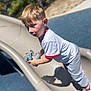 Grayson joined the competition — help win amazing prizes! blond_hair, boy, candid, casual_clothing, child, daytime, outdoors, park, play, playground, portrait, shadow, shallow_depth_of_field, slide, sneakers, stuffed_animal, sunlight, surprised_expression, toddler, toy