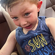 Grayson is registered to the contest to win money with this photo: child, boy, smile, face, eyes, tooth, tank_top, blue_shirt, sun_graphic, seatbelt, car_seat, car_interior, selfie, close_up, portrait, short_hair, playful, candid, seat, ear