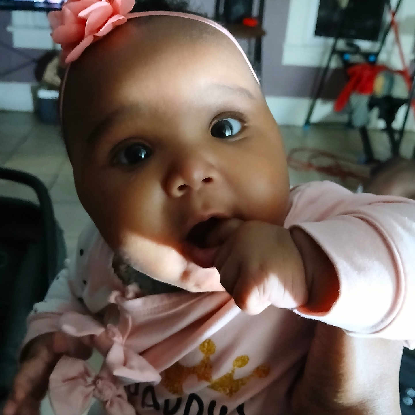 Modestie joined the competition — help win amazing prizes! baby, child, clothing, cute, eyes, face, family, fingers, floor_tile, flower, furniture, hand, home, indoor, infant, person, pink_headband, portrait, sitting, television