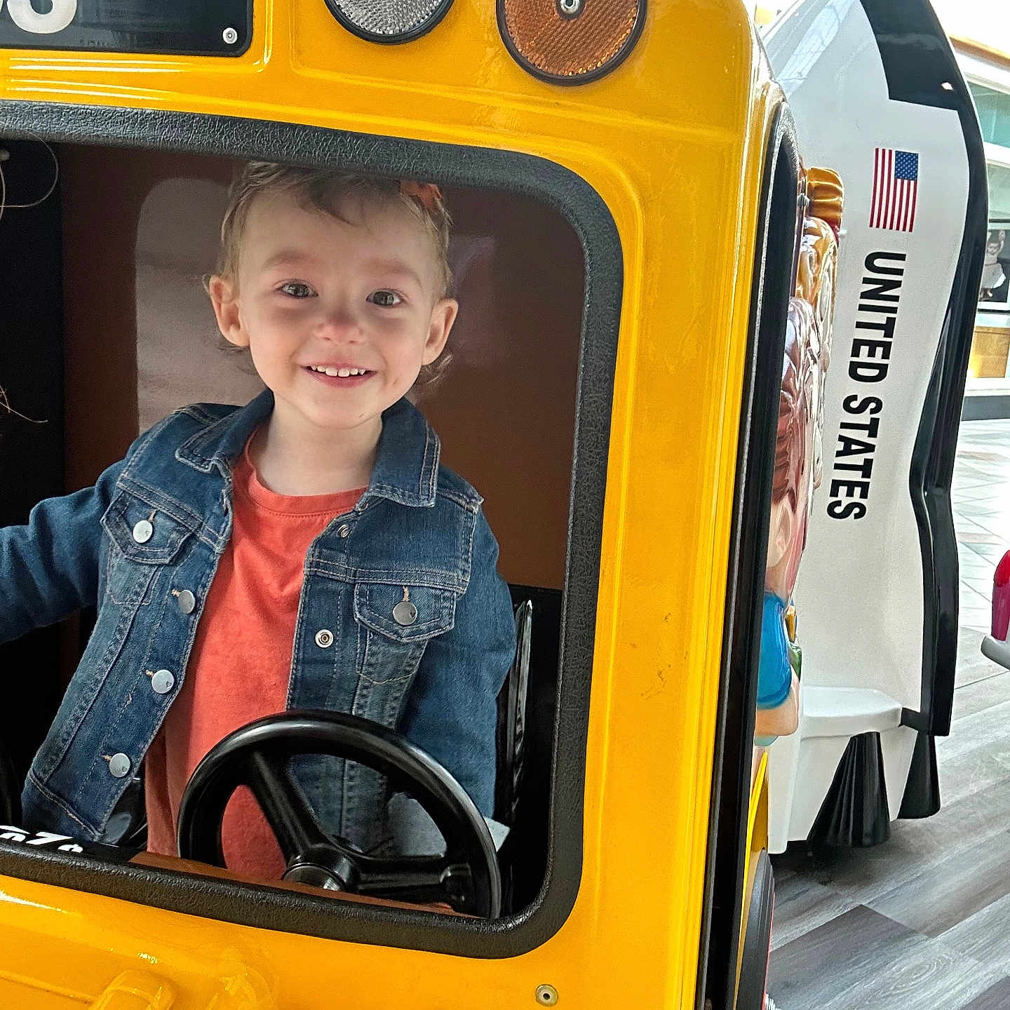 Ava joined the competition — help win amazing prizes! boy, bus, car, child, clothing, coat, face, head, jacket, jeans, machine, male, pants, person, photography, portrait, schoolbus, transportation, vehicle, wheel