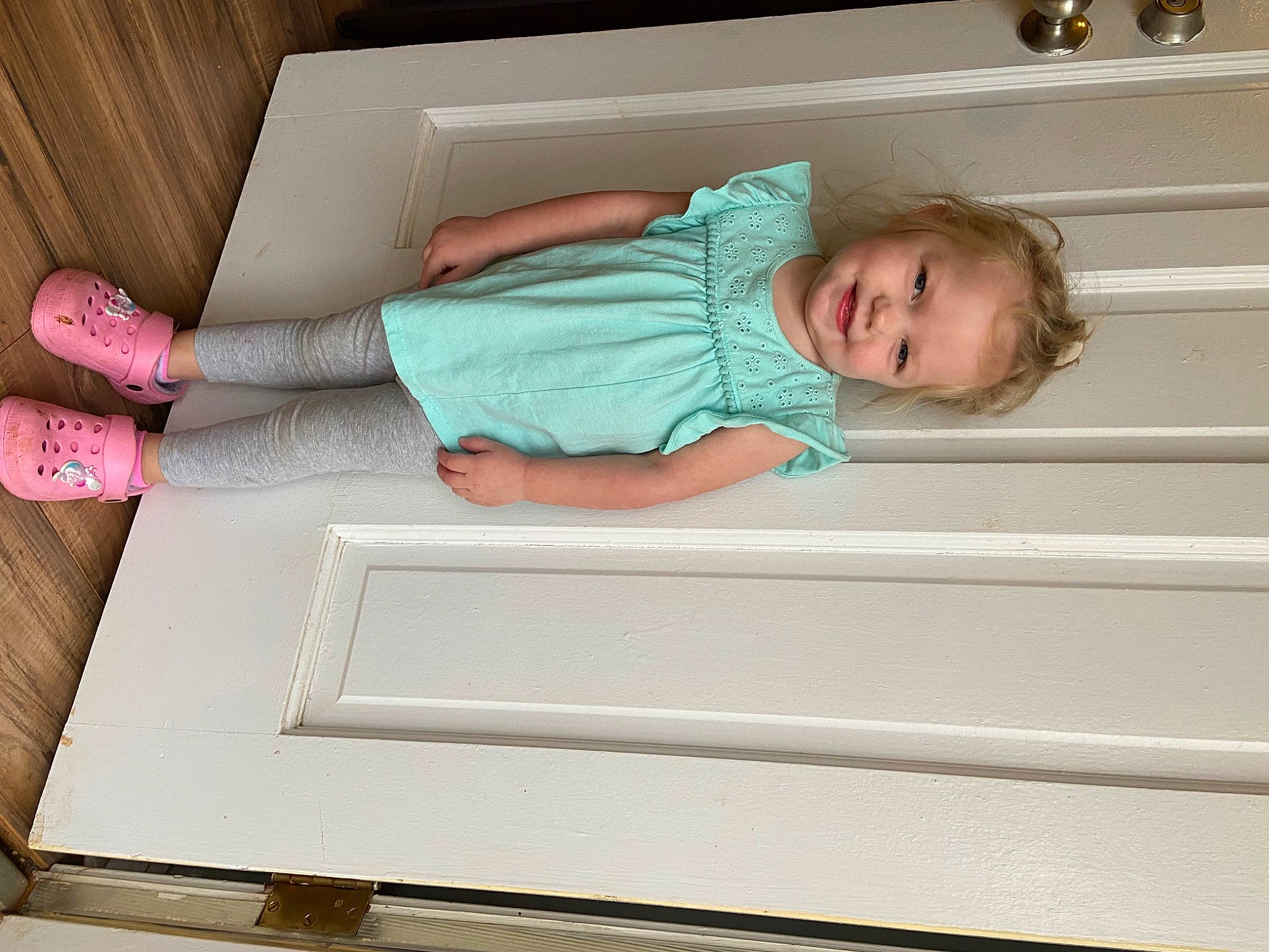 Laiklyn is registered to the contest to win money with this photo: baby, baby_toddler_clothing, child, comfort, flooring, foot, hardwood, human_leg, joy, knee, linens, pattern, person, rectangle, room, smile, sock, t_shirt, thigh, toddler