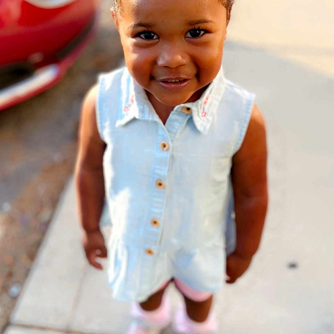 Admire is registered to the contest to win money with this photo: baby, babylaughing, child, clothing, face, female, footwear, girl, hair, happy, head, pants, person, photography, portrait, shoe, sitting, sleeve, smile, standing