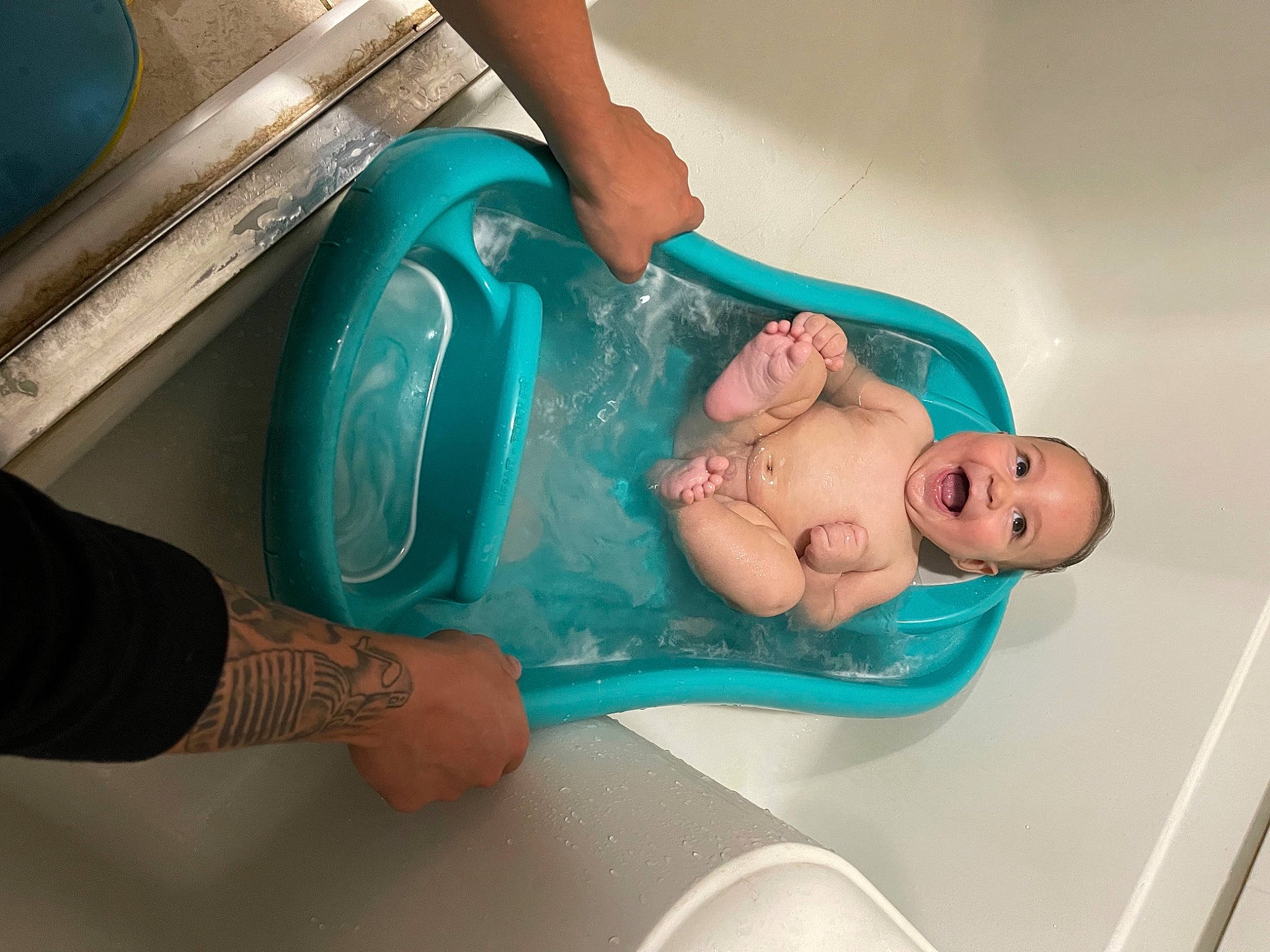 Nash is registered to the contest to win money with this photo: arm, baby, baby_bathing, baby_safety, bathing, bathtub, child, comfort, fun, hand, joint, leisure, medical_procedure, person, personal_care, plumbing, plumbing_fixture, skin, thigh, toddler
