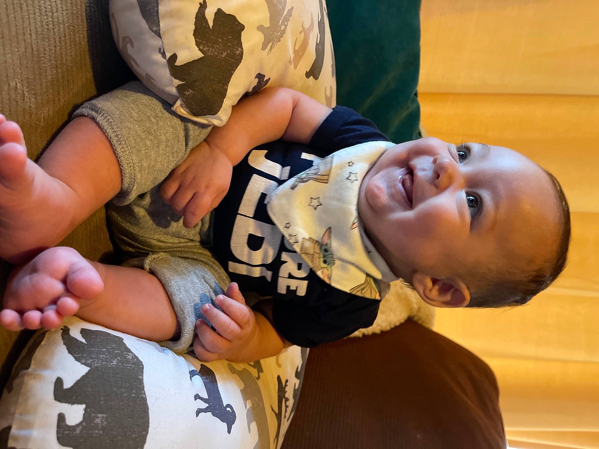 Nash is registered to the contest to win money with this photo: comfort, elbow, eye, facial_expression, finger, fun, gesture, hairstyle, happy, head, human, human_body, joint, mammal, mouth, person, skin, smile, thigh, toddler