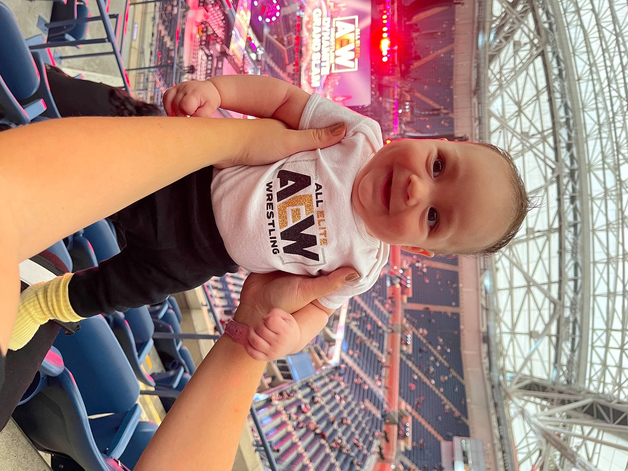 Nash is registered to the contest to win money with this photo: amusement_park, baby, child, elbow, fashion_accessory, fun, hand, happy, hat, human_leg, joy, leisure, pattern, person, recreation, smile, t_shirt, textile, thigh, toddler