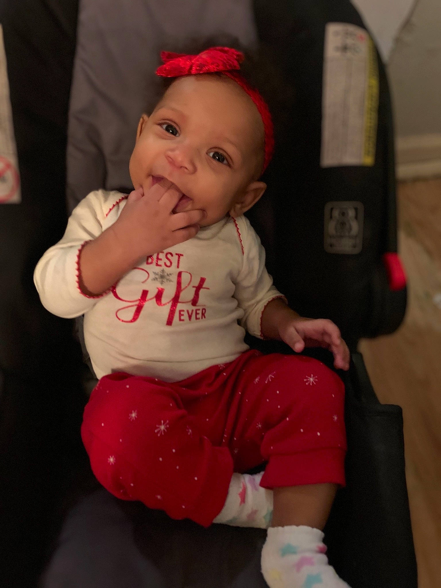 Lorianna is registered to the contest to win money with this photo: baby, baby_toddler_clothing, cheek, child, eye, face, head, lip, person, pink, red, sitting, skin, toddler