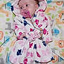 Calena joined the competition — help win amazing prizes! baby, infant, pacifier, robe, blanket, animal_print, cute, sleepwear, child, lying_down, soft, pink, blue, white, pattern, indoors, small_hands, small_feet, face, hood