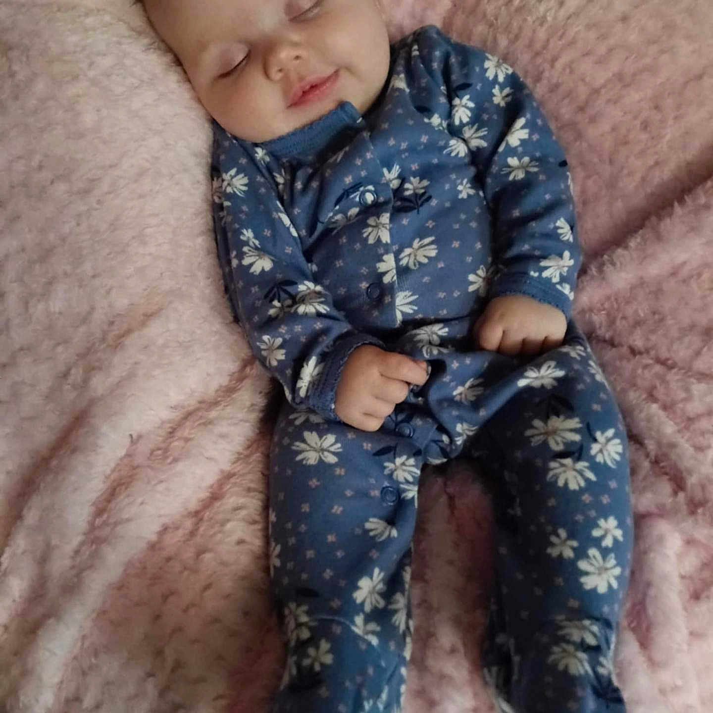 Calena joined the competition — help win amazing prizes! baby, blanket, blue, child, clothing, cozy, cute, cute_face, floral, indoors, infant, onesie, peaceful, person, pink, portrait, resting, sleeping, small_hands, soft